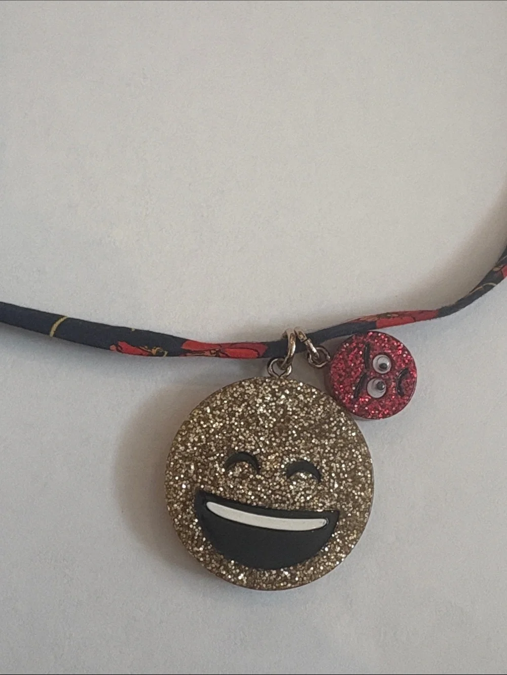 Crewcuts emoji necklace on Liberty of London fabric